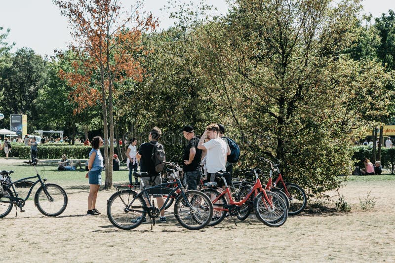 A group of tourists riding bikes sightseeing in Berlin in Germany. Excursion on the bike. royalty free stock photography A group of tourists riding bikes sightseeing in Berlin in Germany. Excursion on the bike. royalty free stock photography