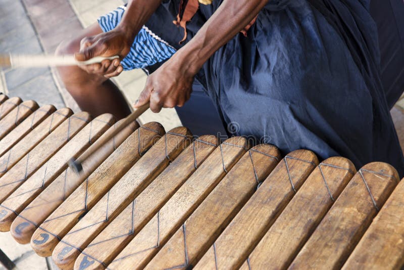 group of traditional african marimba performers playing outdoors at a festival
