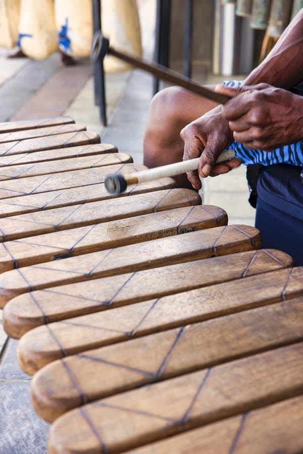 group of traditional african marimba performers playing outdoors at a festival