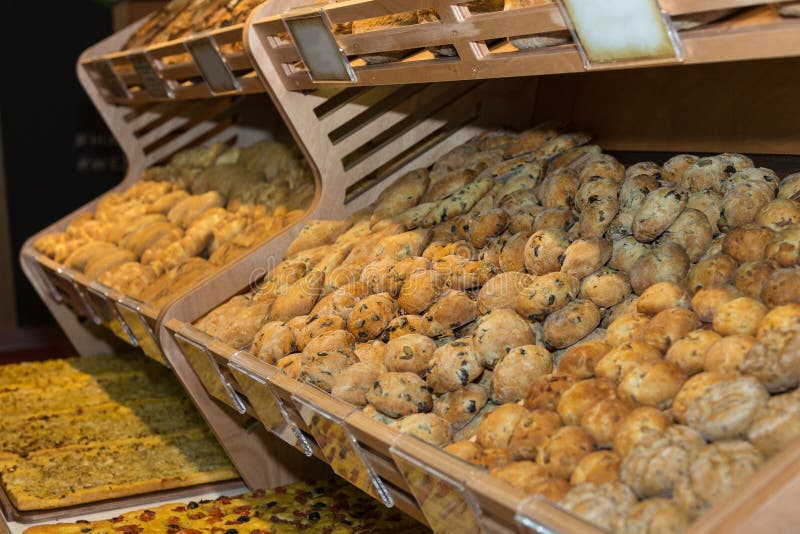 Group of Various Types of Bread, and Loaves Inside a Bakery Stock Photo