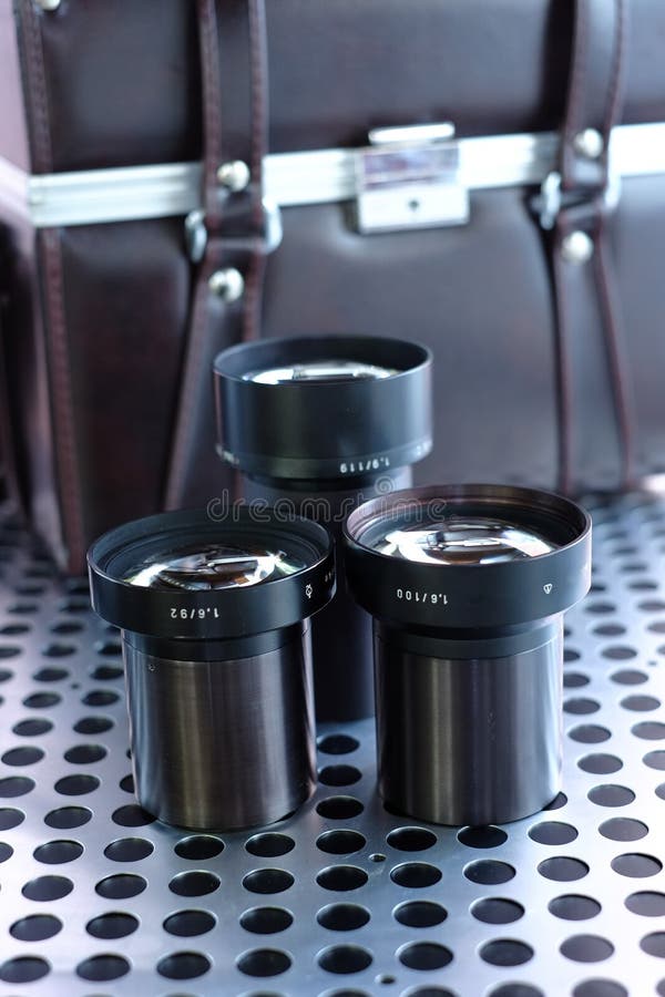 Group of Vintage Projector Lenses on Metalic Background Stock Image