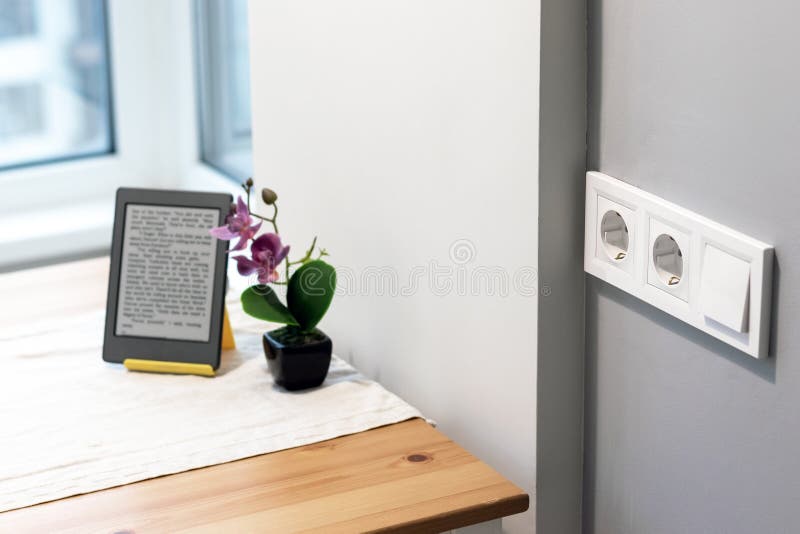 Group of White European Electrical Outlets and a Switch Located on a