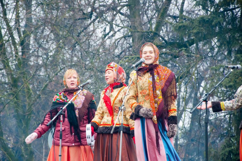 The group of women in traditional Russian clothers sing a song on Maslenitsa in Moscow.