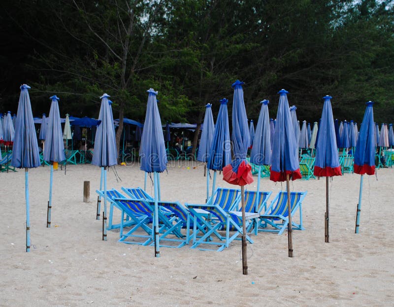 Group of Wooden Beach Chair and Umbrella on the Beach Stock Image
