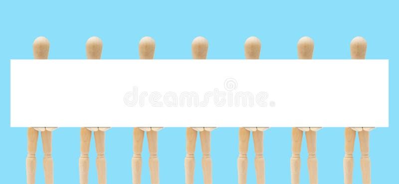 Group of wooden figure mannequin holding empty space white paper in hand. stock photo Group of wooden figure mannequin holding empty space white paper in hand. stock photo
