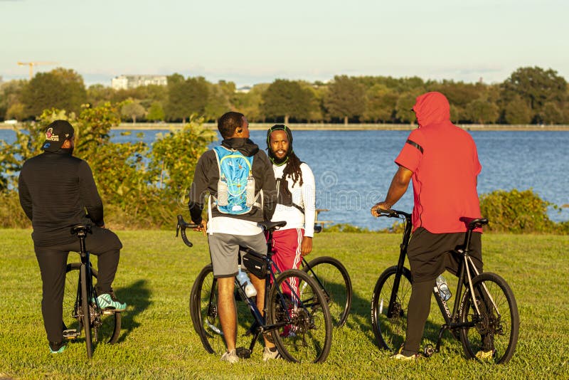 A group of young African American men are on their bike before a leisurely cycling trip