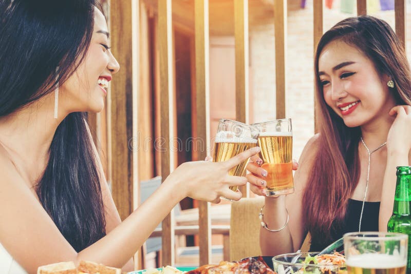 Group of young asian people celebrating beer festivals happy while enjoying home party royalty free stock photo Group of young asian people celebrating beer festivals happy while enjoying home party royalty free stock photo