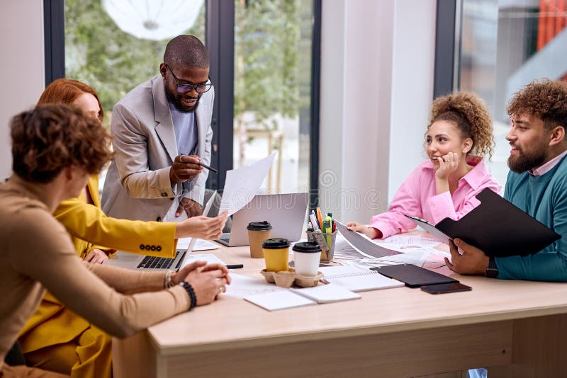 Group of Young Business People Having Meeting in Office, Having Talk