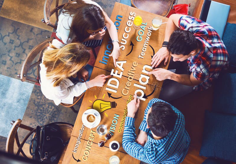 Group of young and creative people at the table, talking, planing