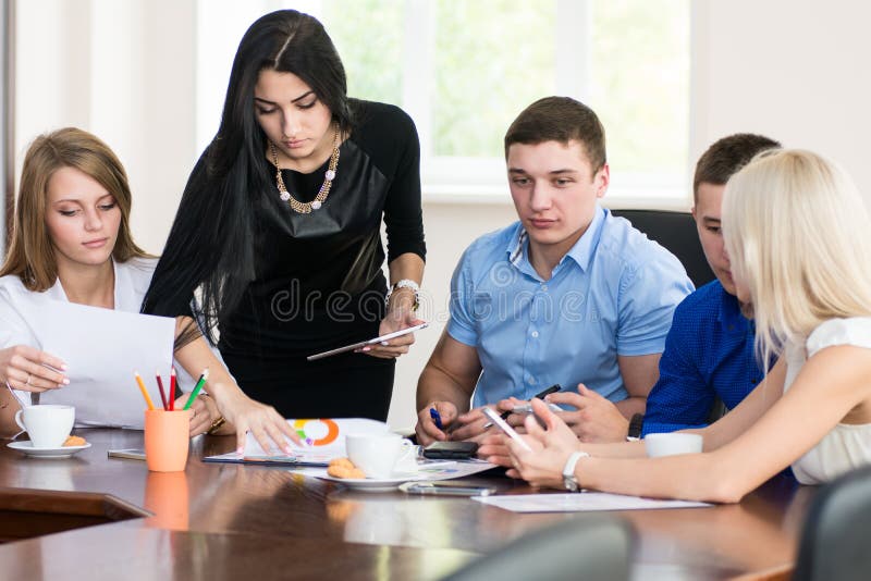 A Group of Young Business People in the Office Having Fun Discus Stock