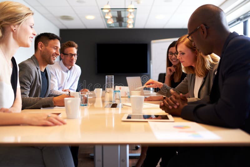 Group of young executives having a meeting stock images Group of young executives having a meeting stock images