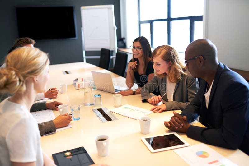 Group of young executives having a work meeting stock images Group of young executives having a work meeting stock images