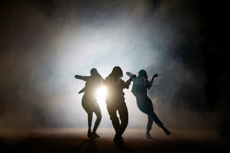 Group of young female dancers on the street at night royalty free stock photography Group of young female dancers on the street at night royalty free stock photography
