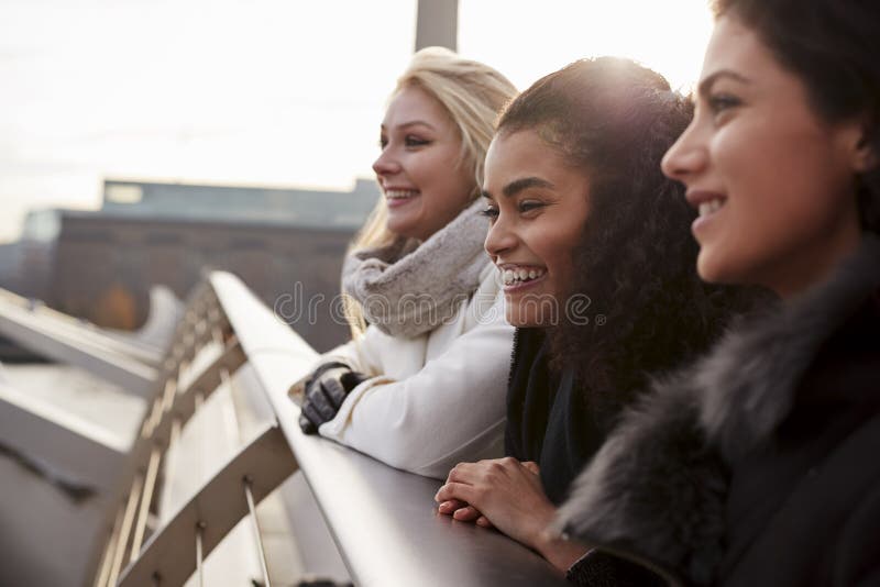 Group Of Young Female Friends Visiting London In Winter royalty free stock photography Group Of Young Female Friends Visiting London In Winter royalty free stock photography
