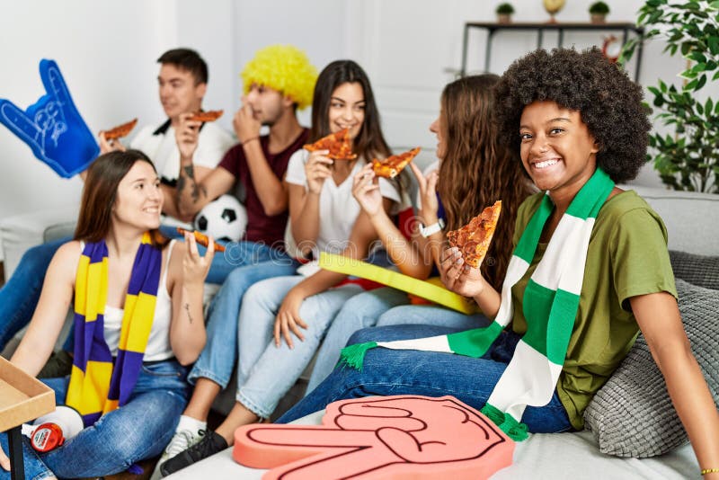 Group of Young Friends Watching and Supporting Soccer Match Eating ...