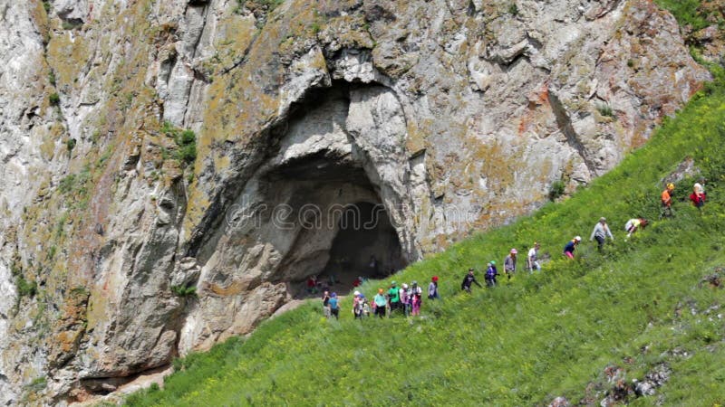 Group of young hikers hiking in the mountain.