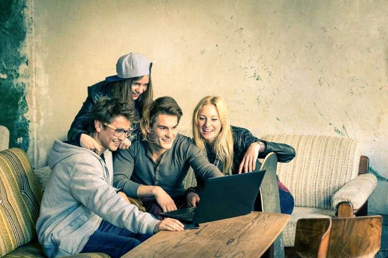 Group of young hipster best friends with computer laptop