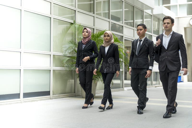 A group of young mixed Asian Executive at the wearing suit