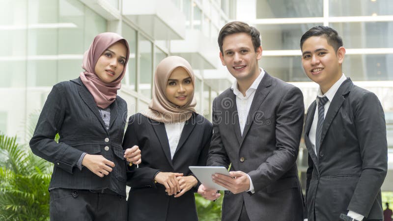 A group of young mixed Asian Executive at the wearing suit