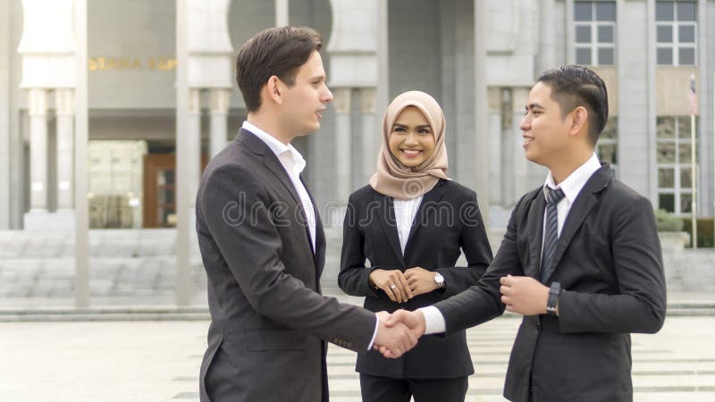 A group of young mixed Asian Executive at the wearing suit