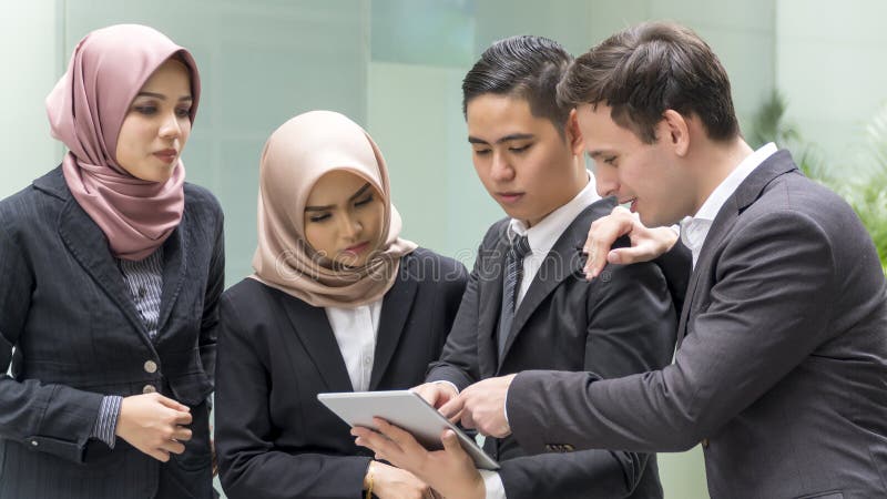 A group of young mixed Asian Executive at the wearing suit