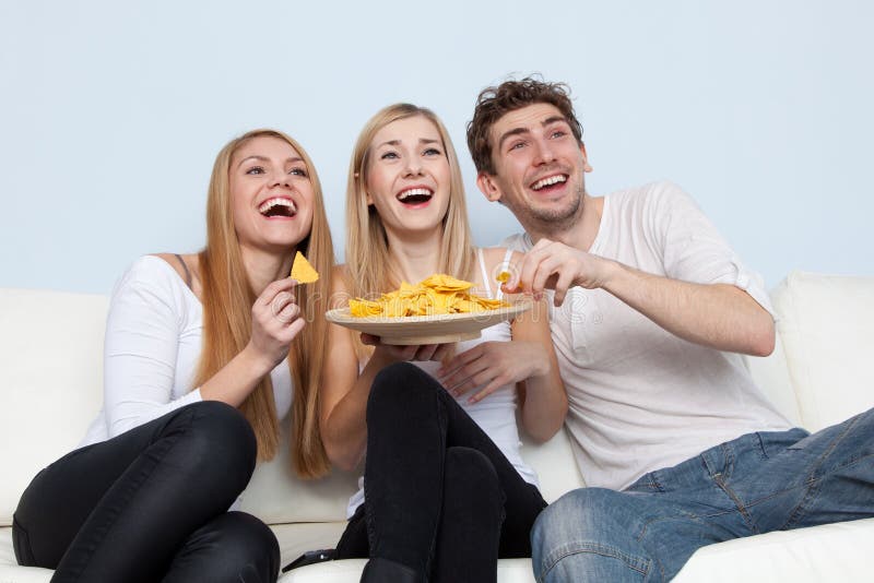 Three Friends Eating Pizza Stock Photo, Picture and Royalty Free Image.  Image 10735477.