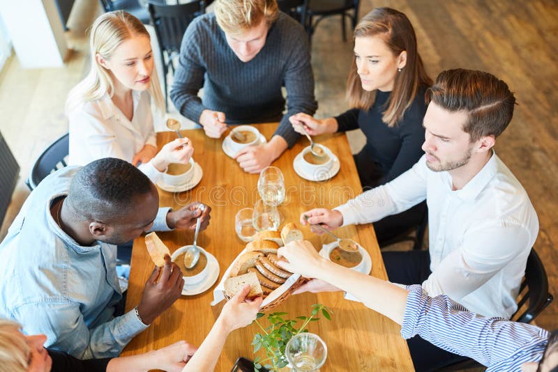 Group of young people while eating soup