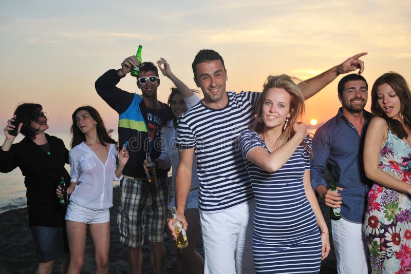 Group of young people enjoy at the beach