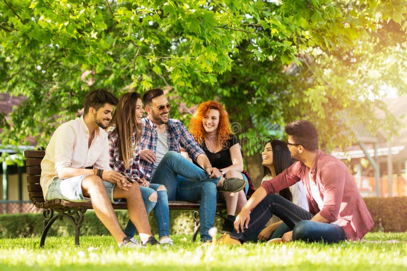 Group of young people having fun outdoors, happy