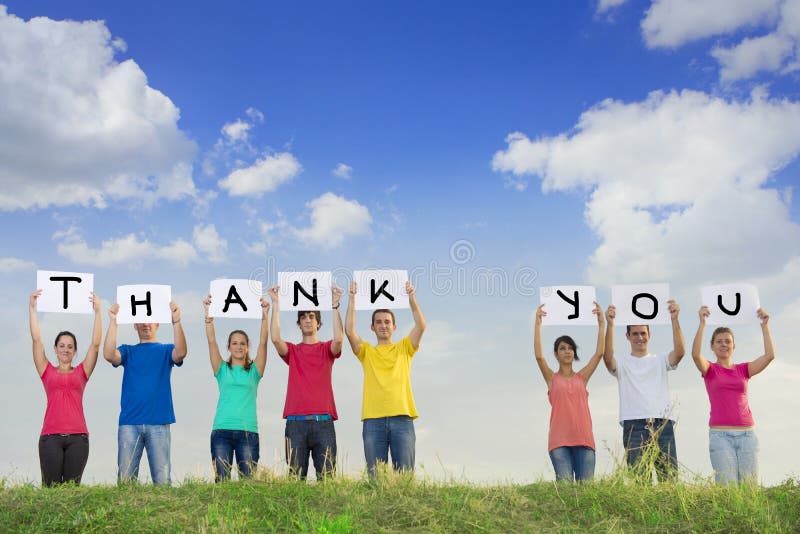 Group of young people spelling thank you