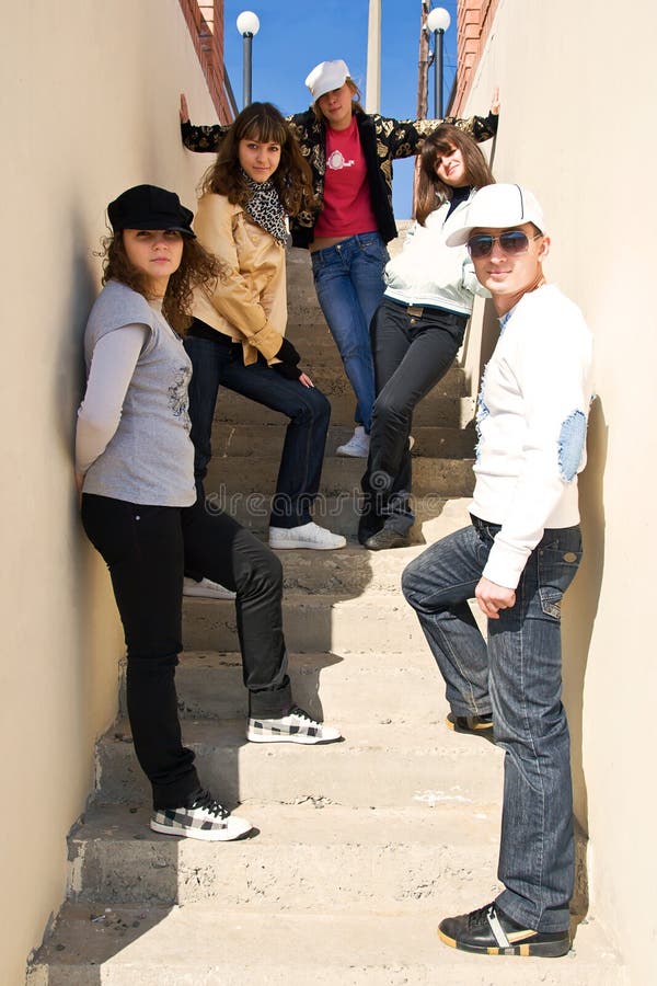 Group of young people standing on stairs