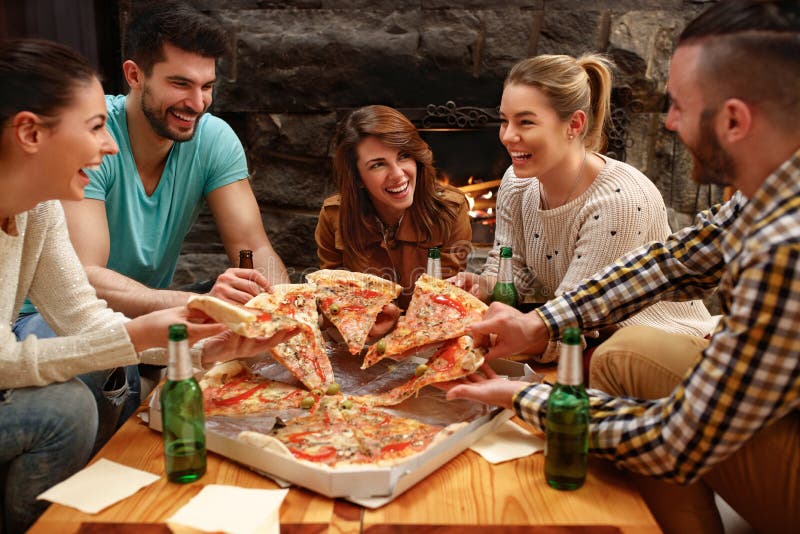 Group of Young People Taking Pieces of Big Family Pizza Stock Image ...