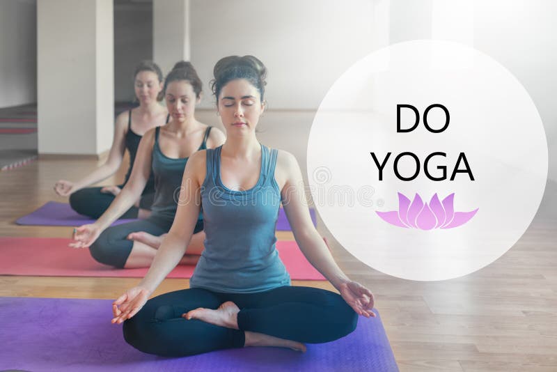 A group of young women doing yoga in the classroom. The concept of sports, meditation and yoga practice. Asana of sage. Tint. Text royalty free stock images A group of young women doing yoga in the classroom. The concept of sports, meditation and yoga practice. Asana of sage. Tint. Text royalty free stock images