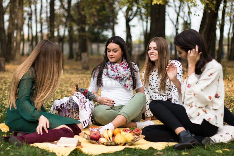 Group of young women having a picnic in the park