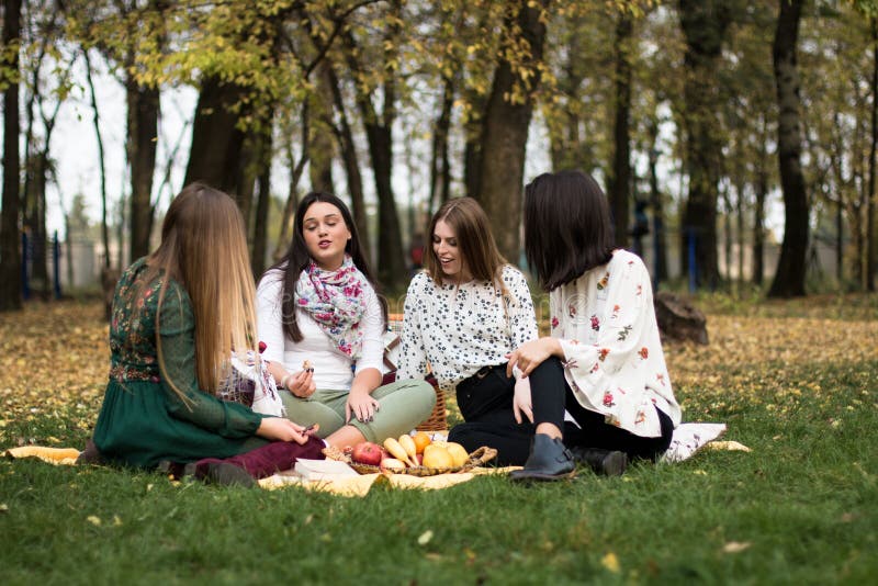 Group of young women having a picnic in the park