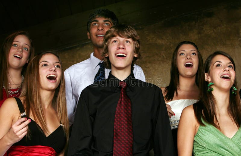 Teens singing in choir in formal dress. Teens singing in choir in formal dress