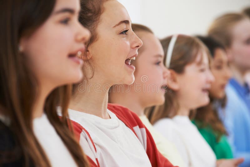 School Children Singing In Choir Together. School Children Singing In Choir Together