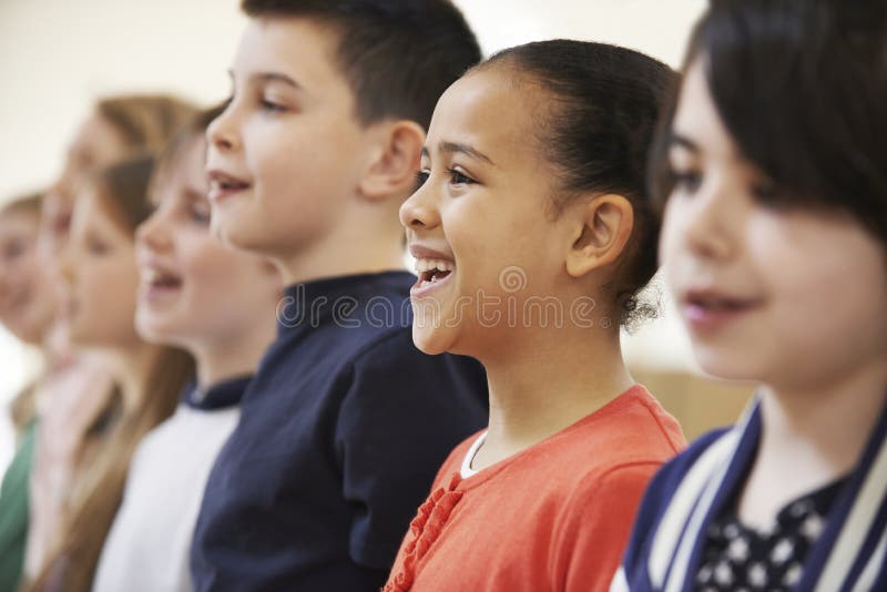 School Children Singing In Choir Together. School Children Singing In Choir Together