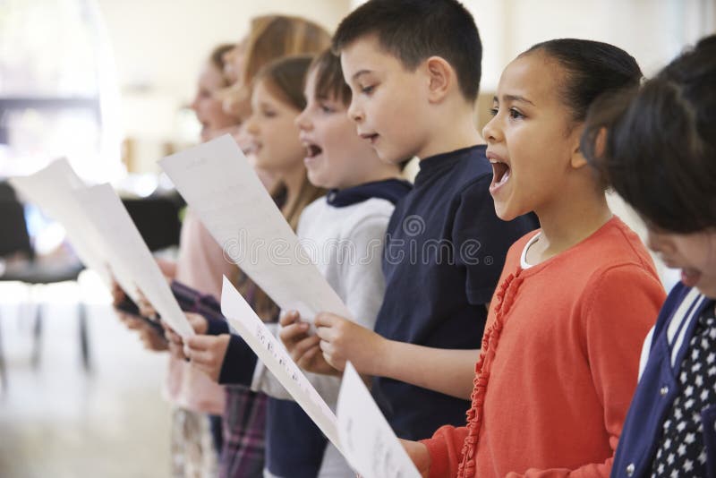 School Children Singing In Choir Together. School Children Singing In Choir Together