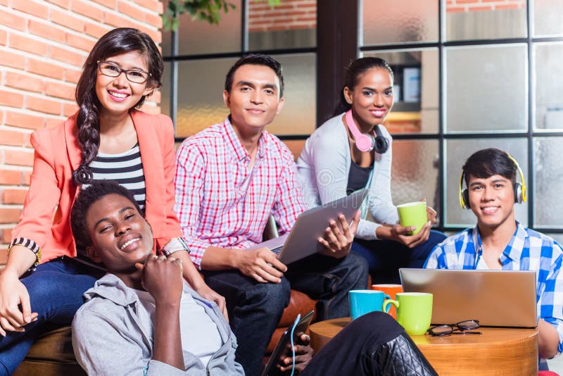 Group of diversity college students learning on campus, Indian, black, and Indonesian people. Group of diversity college students learning on campus, Indian, black, and Indonesian people