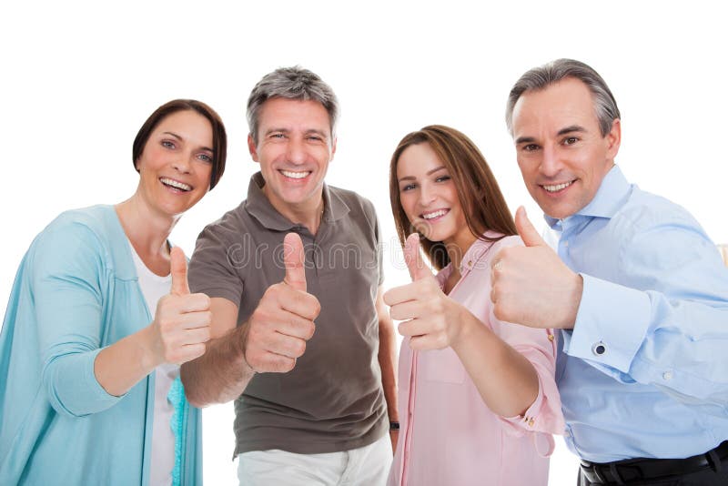 Groupe de personnes heureuses montrant le pouce vers le haut du signe photo stock