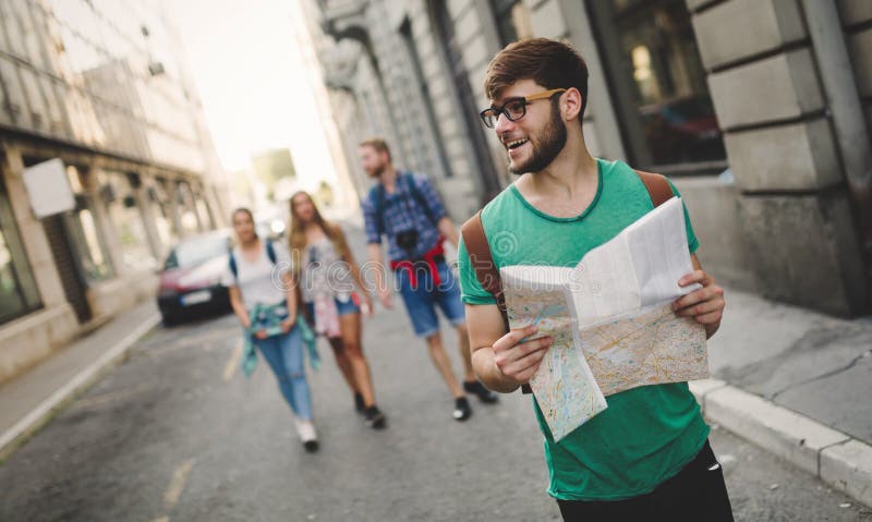 Happy young tourists travelling and sightseeing city. Happy young tourists travelling and sightseeing city