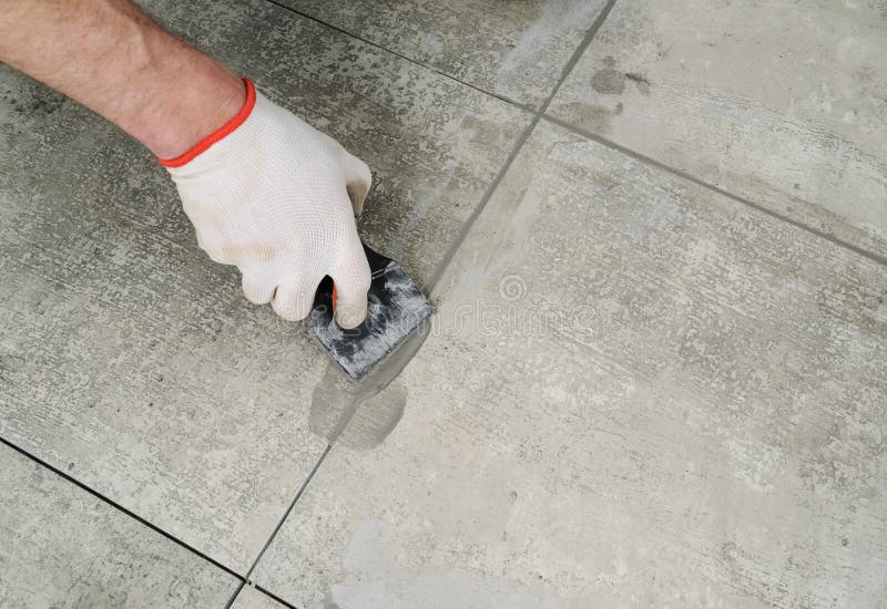 Grouting ceramic tiles. stock image. Image of renovation 75883999