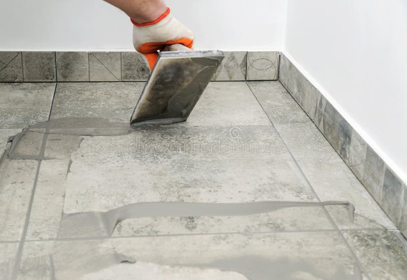 Man Grouting a Ceramic Tile Floor Stock Image Image of ceramic