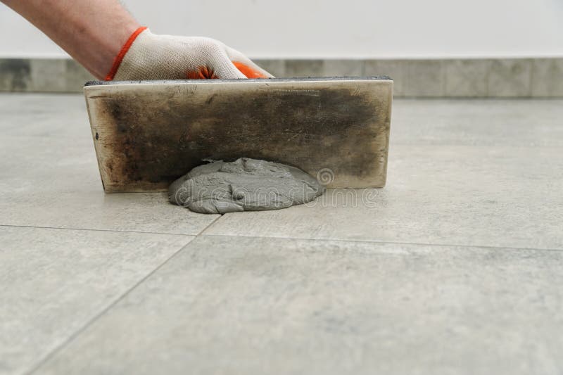 Grouting ceramic tiles. stock photo. Image of install 76441836