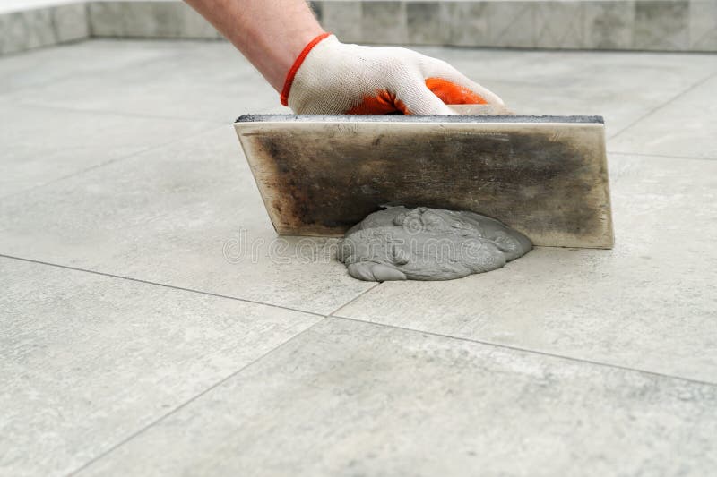 Grouting ceramic tiles. stock image. Image of renovation 75883999