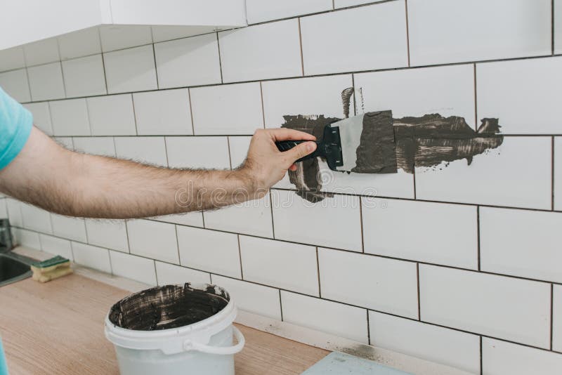 Grouting Tiles in the Kitchen. Repair Stock Photo Image of grout