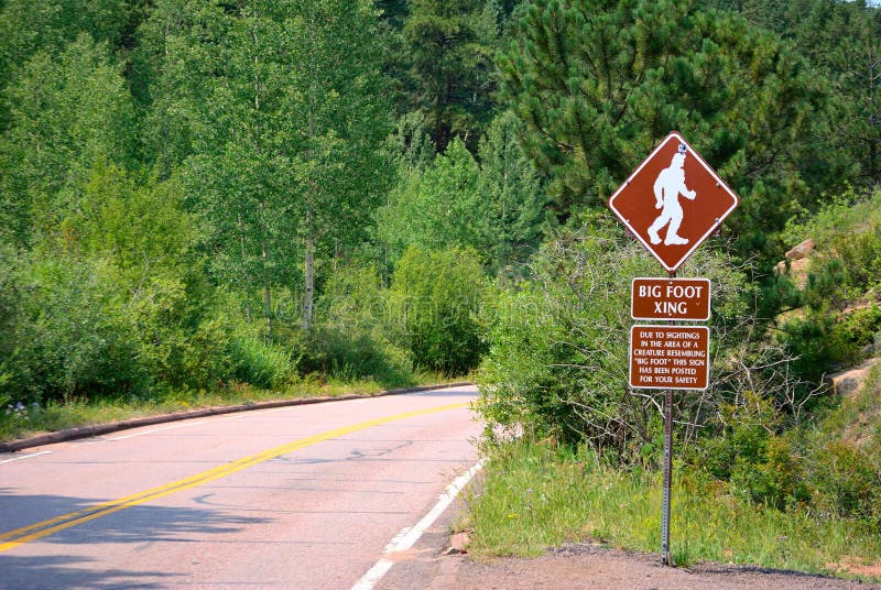 Road sign warns of Bigfoot Crossing. Road sign warns of Bigfoot Crossing