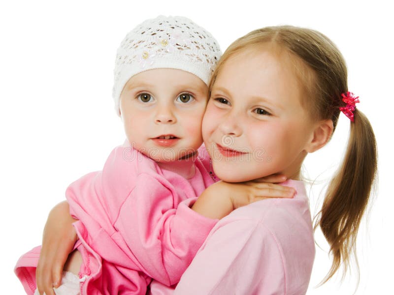 Große Schwester, Umarmen der kleinen Schwester stockbilder
