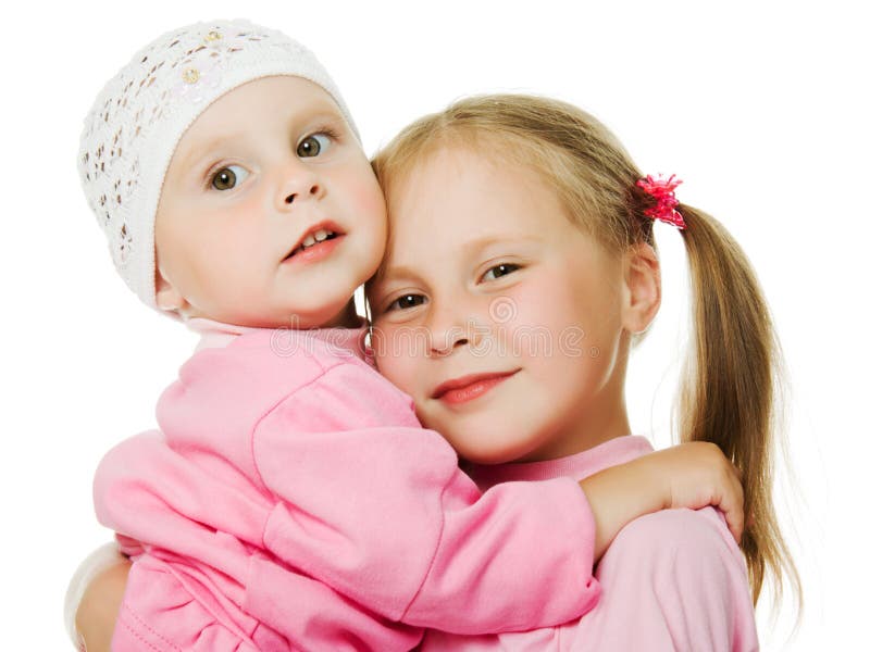 Große Schwester, Umarmen der kleinen Schwester stockbilder